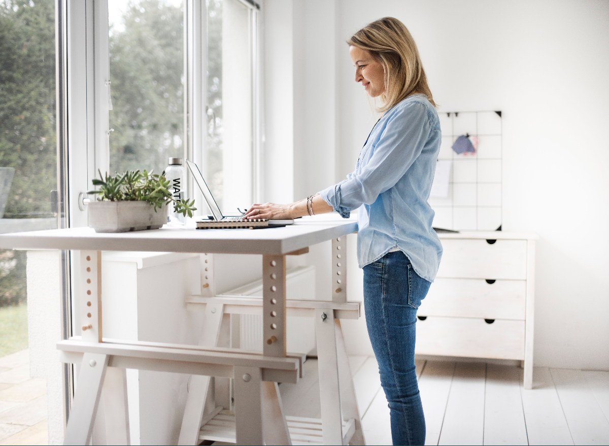 woman at desk standing