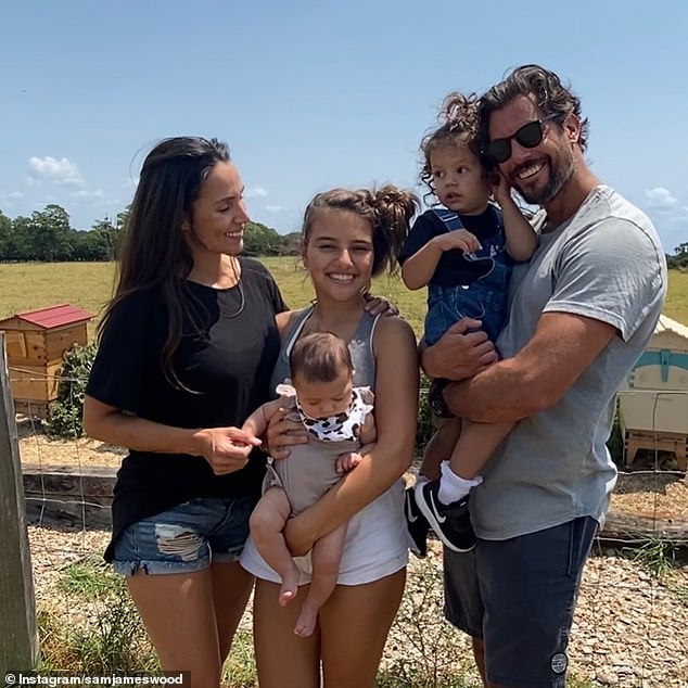 Separated: The Bachelor star revealed he is currently battling Covid-19 and isolating himself from his wife Snezana Wood and the couple's three daughters in a 'family shack'  all in the photo