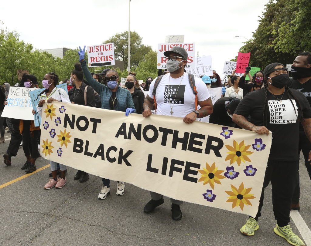 Thousands of protesters filled Christie Pits Park, then marched along Bloor St. W. and then to Toronto Police Headquarters demanding justice for Regis Korchinski-Paquet, a 29-year-old woman with mental health problems who died at the fall from a high park balcony Wednesday after officers responded to an assault call, Saturday, May 30, 2020.