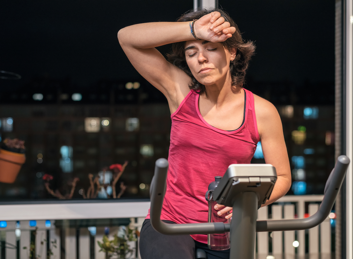 woman doing spinning exercise at night