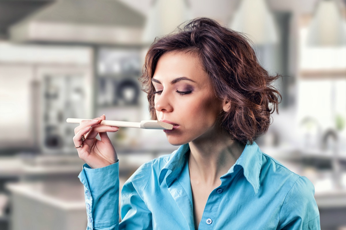 girl with a spoon near her mouth