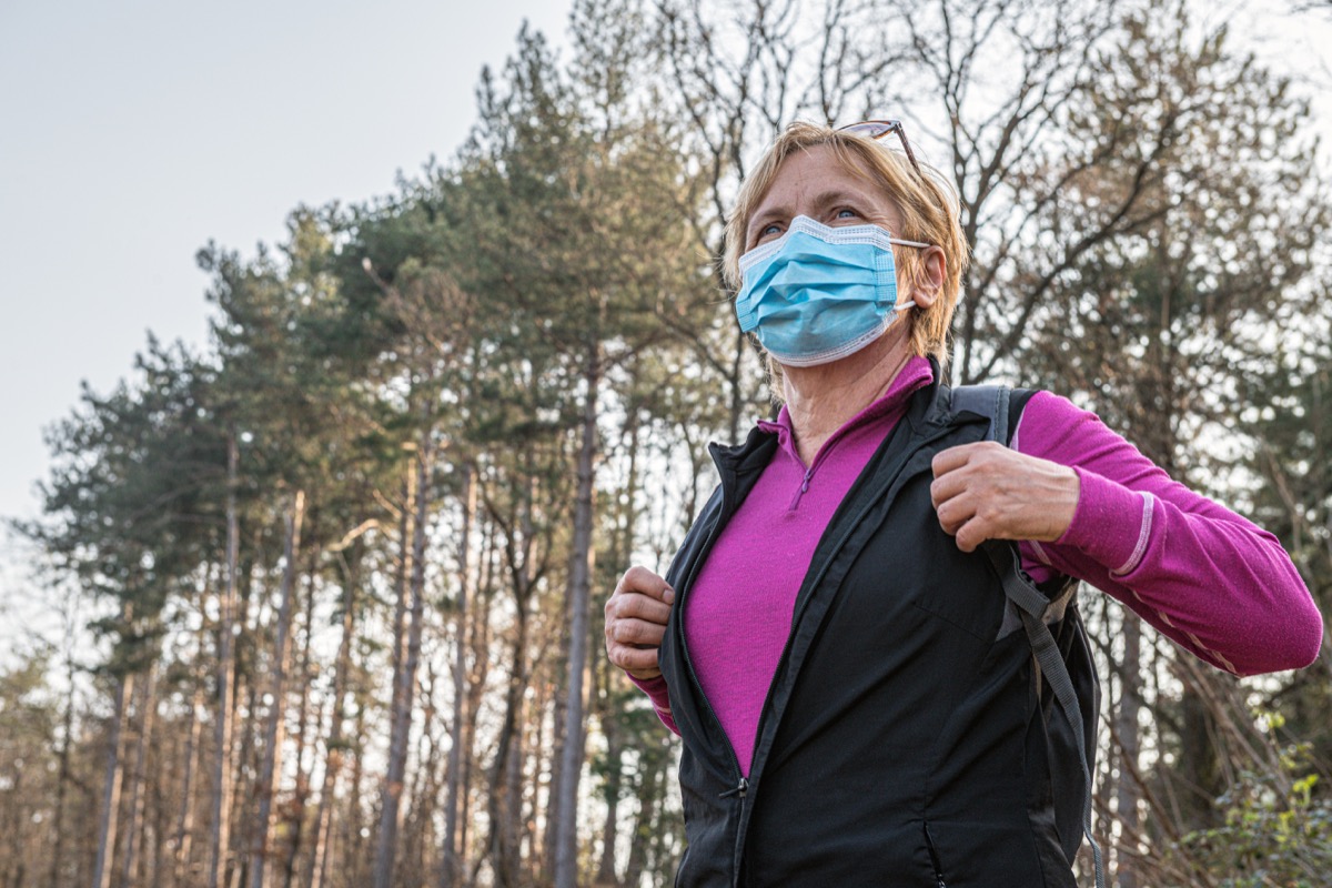 Senior woman exercising alone in nature due to Covid 19, Slovenia, Europe,Nikon D850