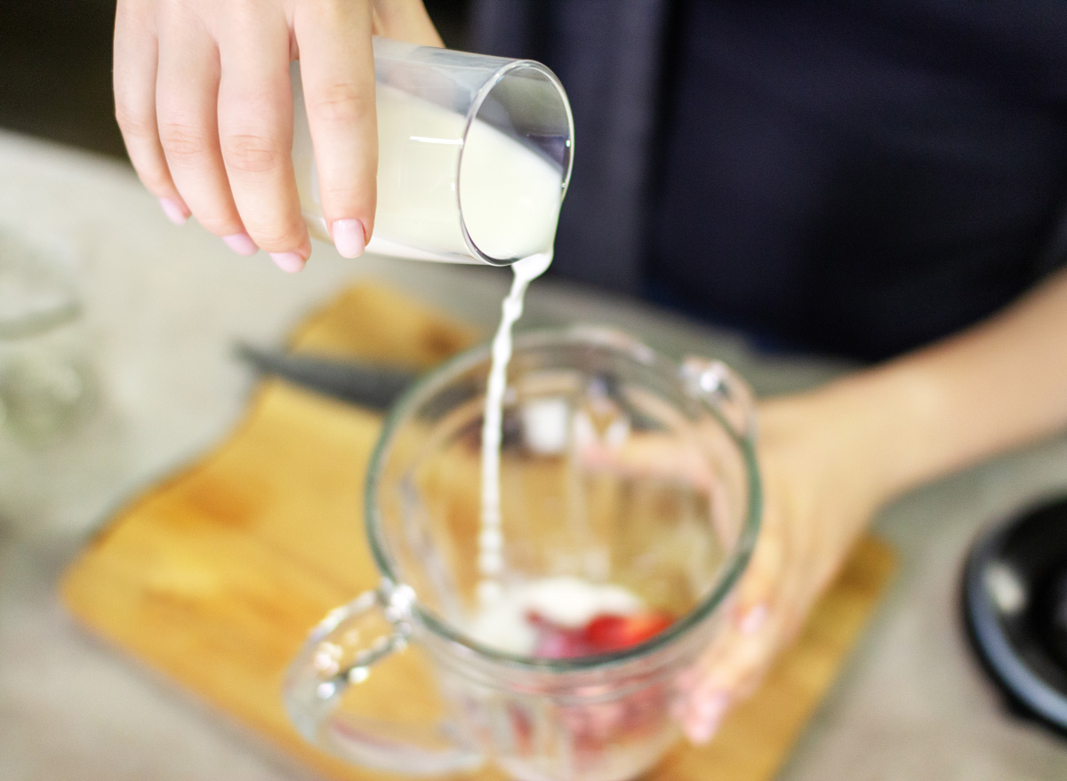 pour the nut milk alternative into a smoothie in a blender