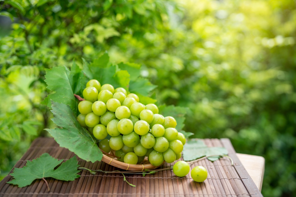 Bunch of grapes on a table outside