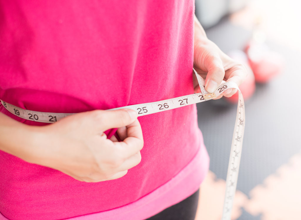 Woman measuring waist