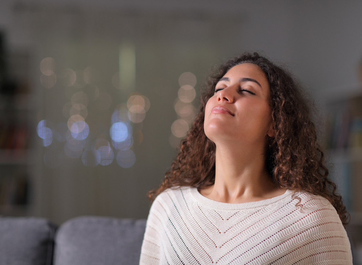 woman taking a deep breath