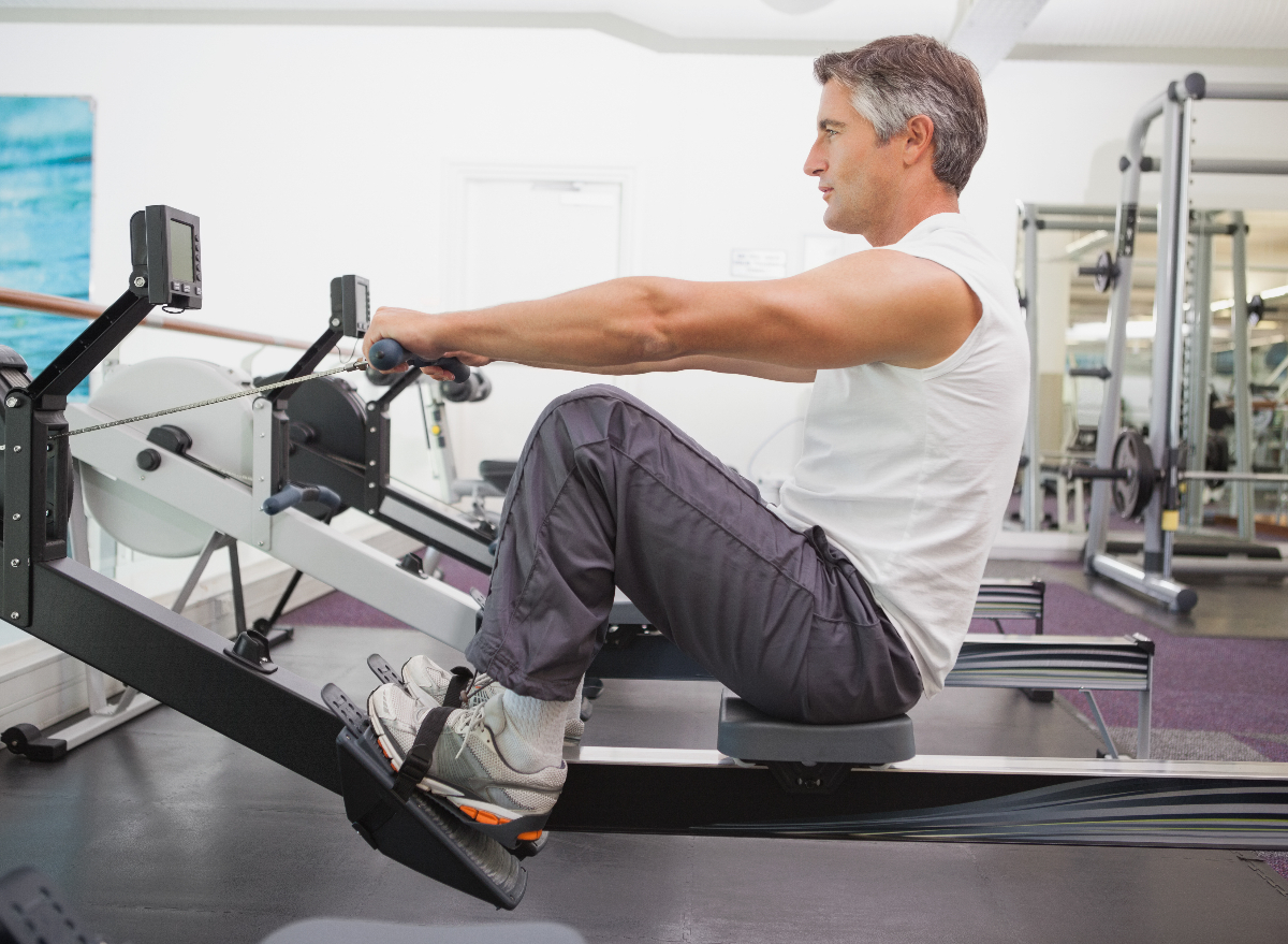 mature man exercising on a rowing machine