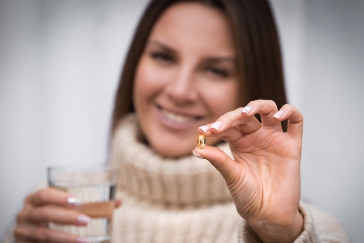 woman taking vitamin D3