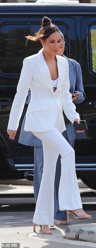 Going glam: The 30-year-old fitness entrepreneur stunned in a white pantsuit, which she teamed with a white bralet top