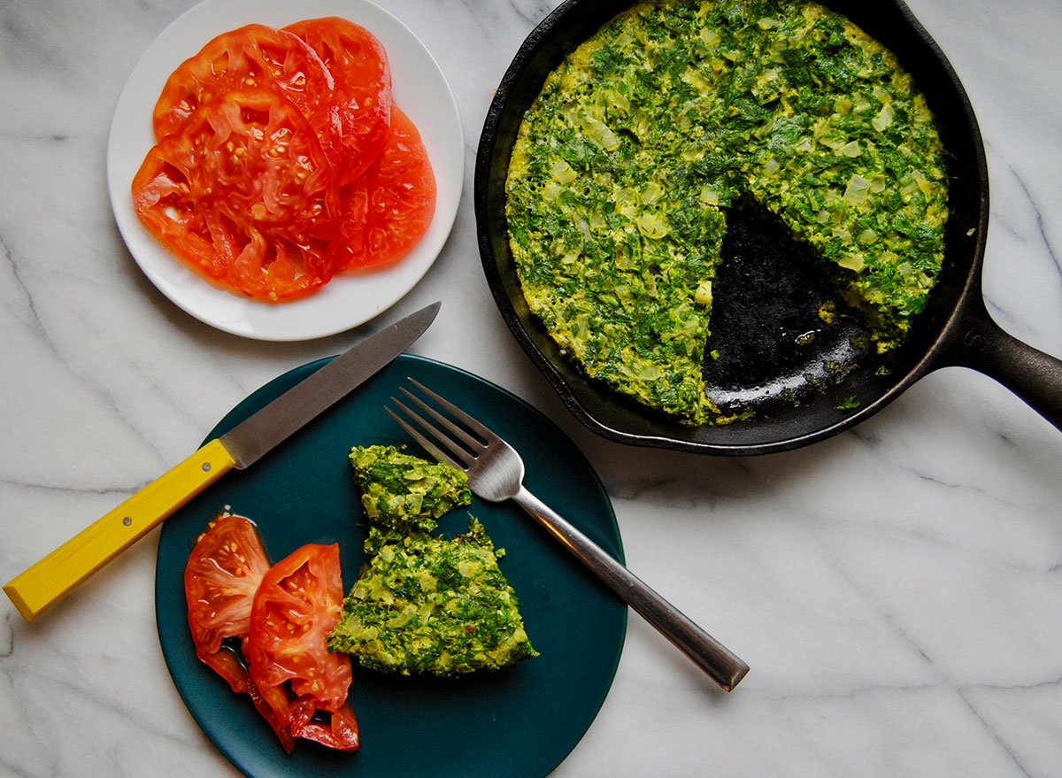 egg and herb frittata in pan and on plate