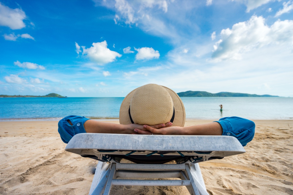 woman relaxing on the beach, sea view, seascape outdoor vacation