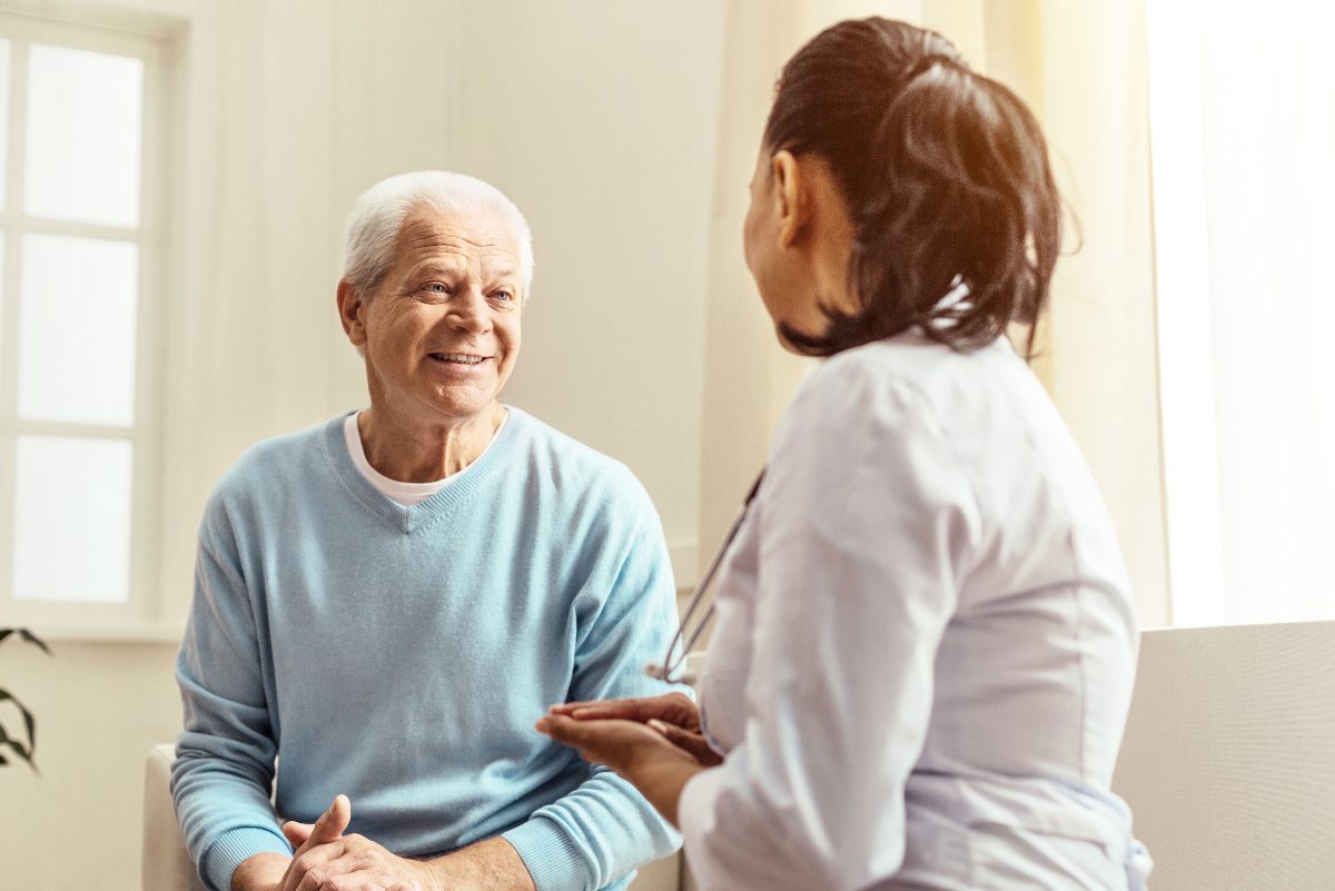 older man consulting with doctor