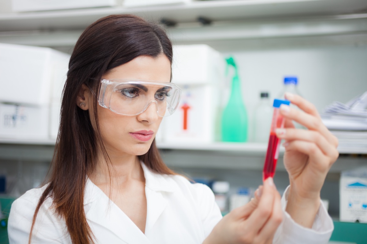 Scientist examining a test tube in a laboratory