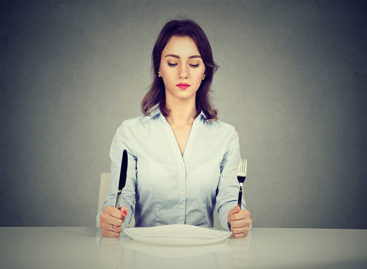 Woman with empty plate