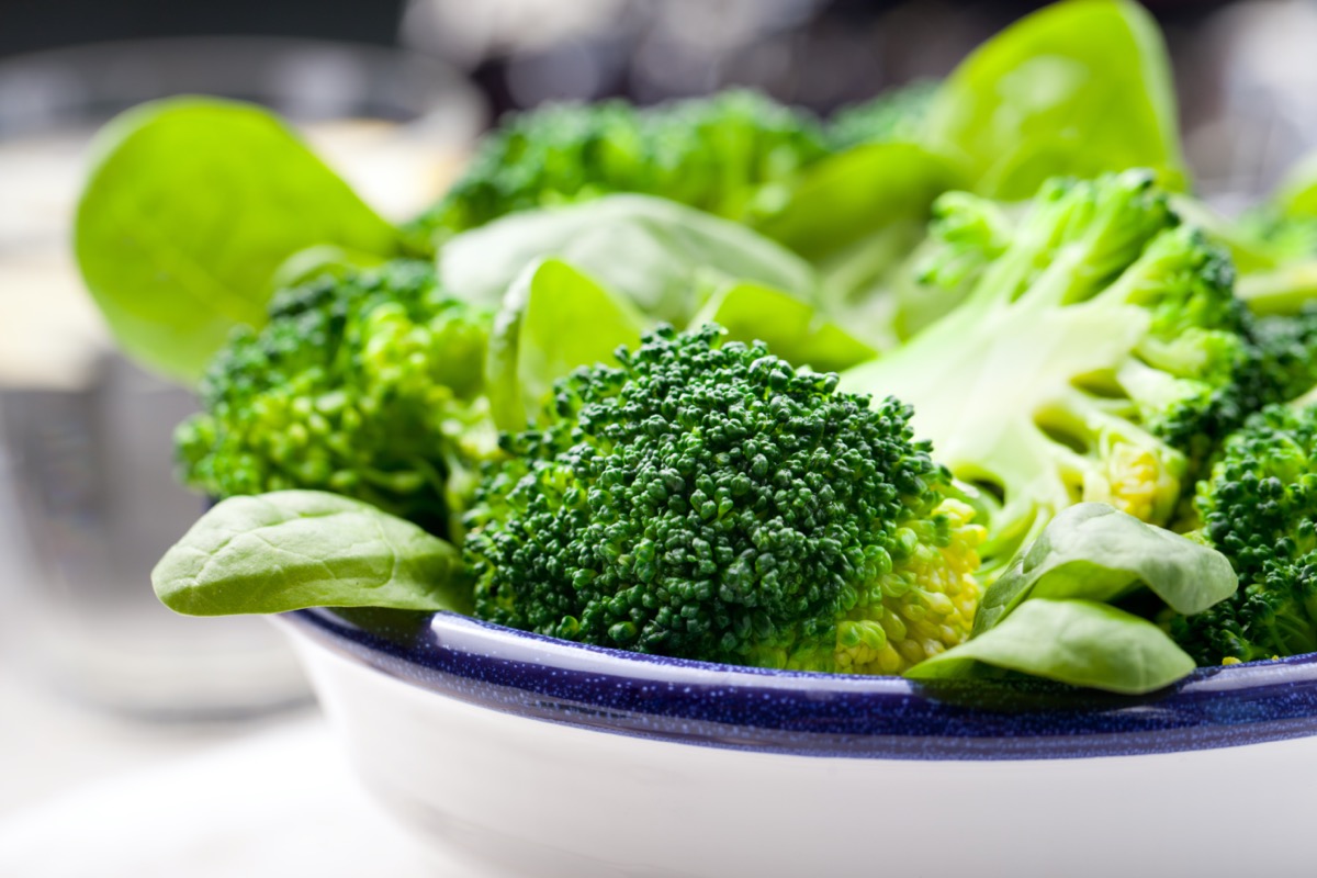 Broccoli, spinach and green bean salad in ceramic bowl