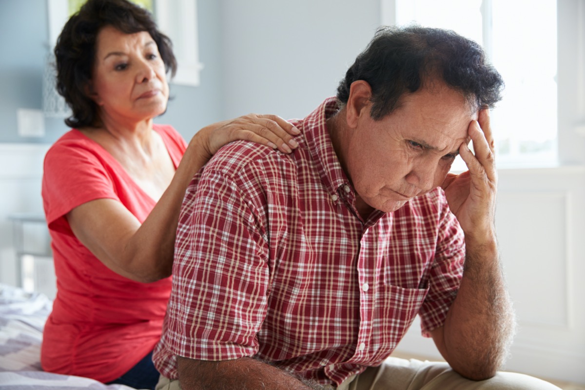 Comforting elderly husband suffering from dementia