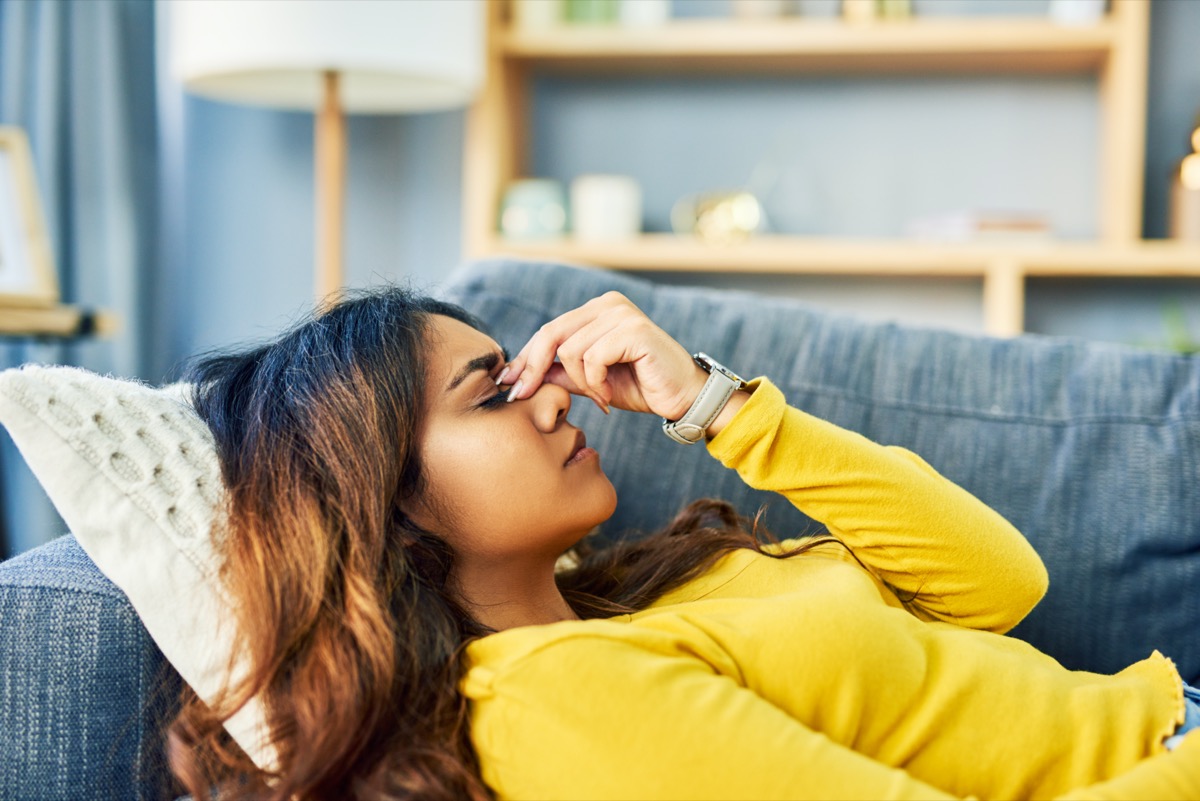 Woman experiencing a severe headache