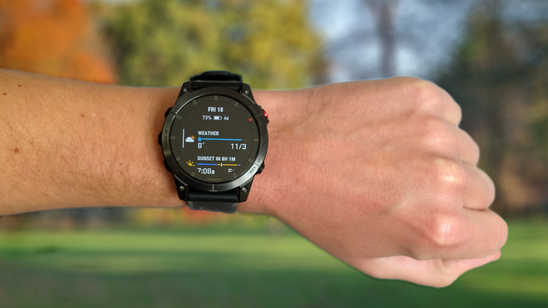 Garmin Epix 2 worn on person's wrist, showing weather on watch face