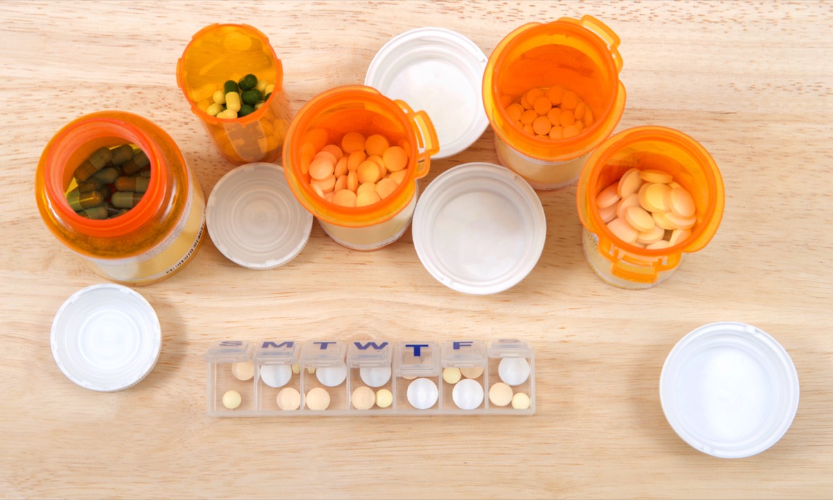 A variety of open pill bottles