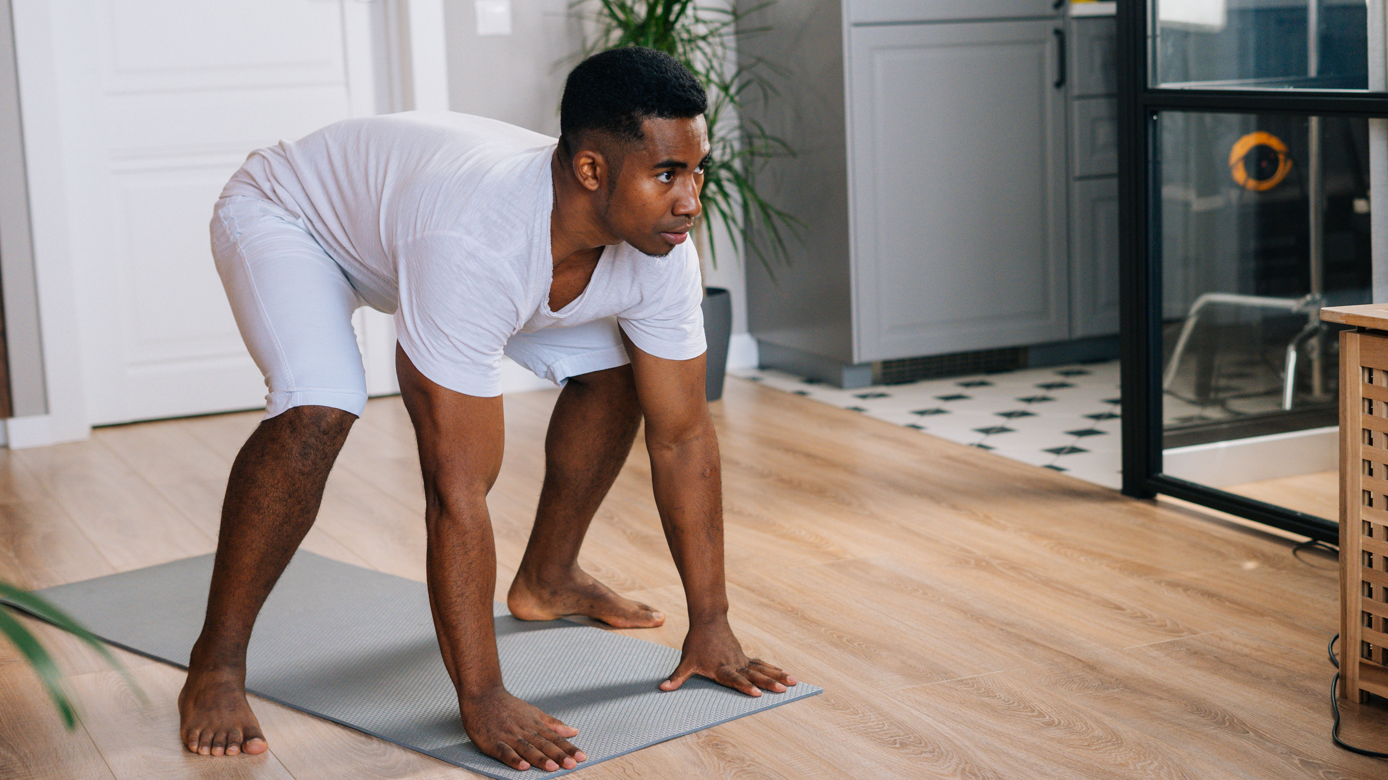 Man doing Tabata workout at home