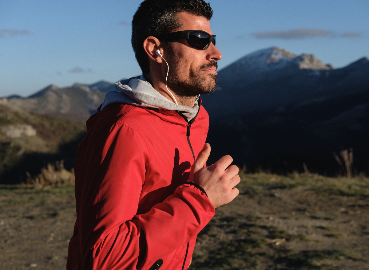 fit middle-aged man runs outdoors to treat sleep apnea