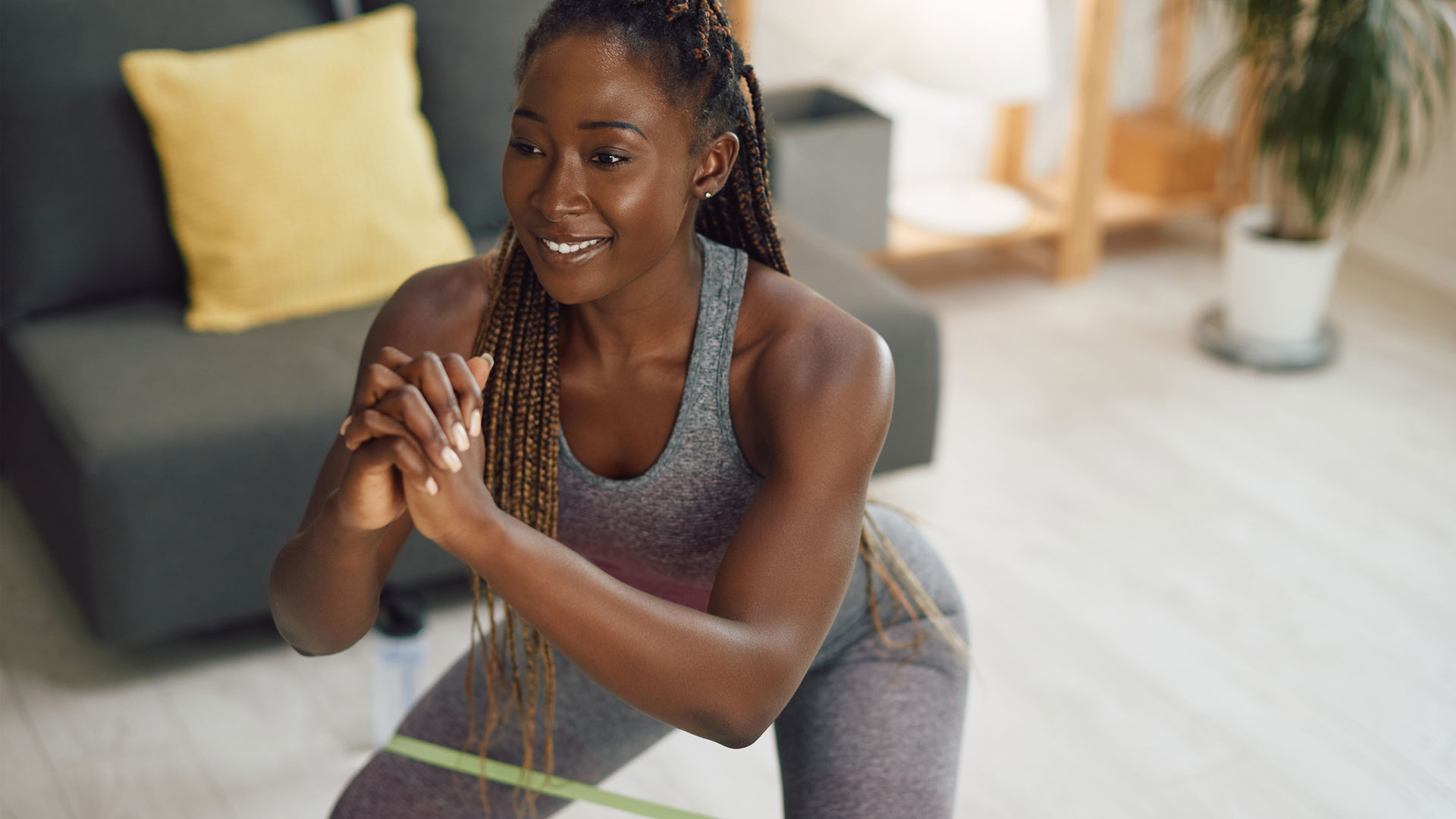 How To Do Squats With Resistance Bands - Woman Exercising With Resistance Band