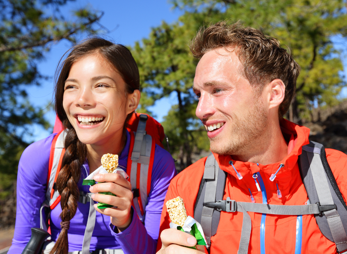 hikers eating granola bars