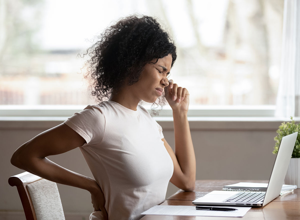 woman with pain sitting