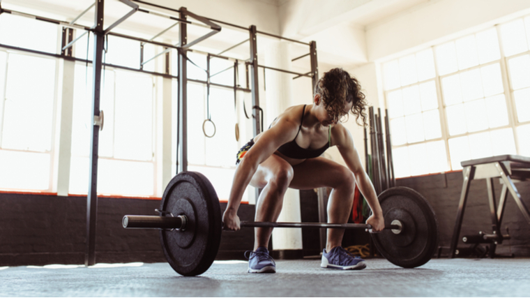 A person sets up to perform a snatch.