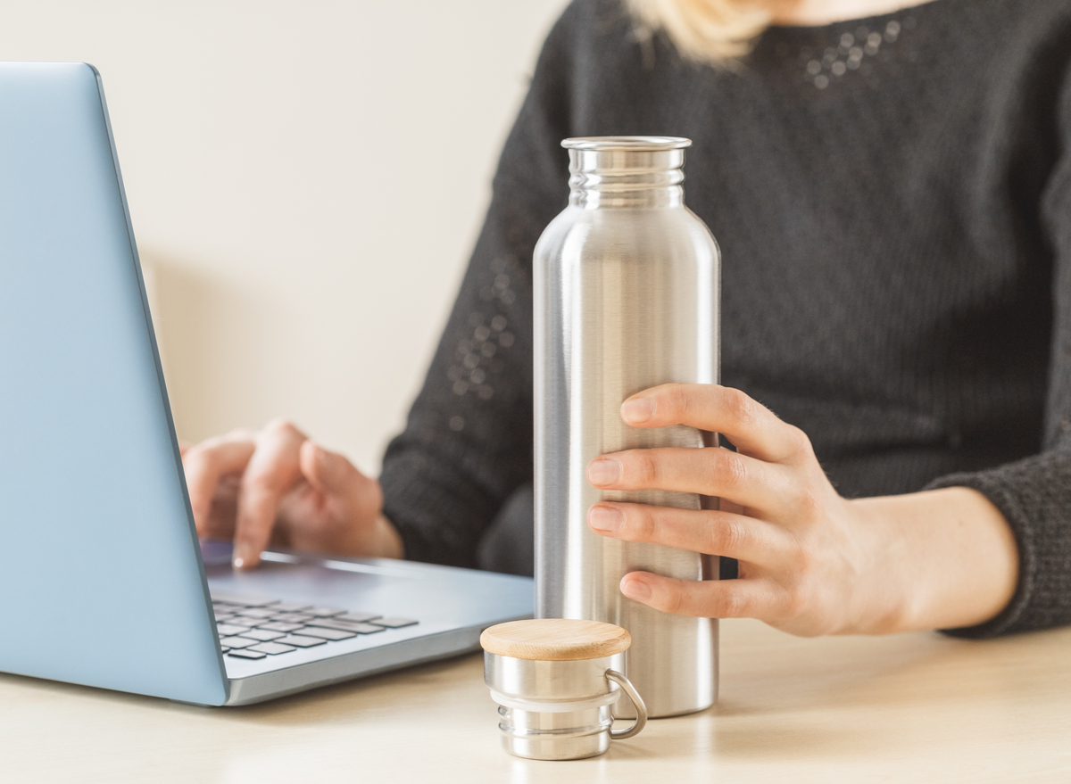 woman holding a bottle of water