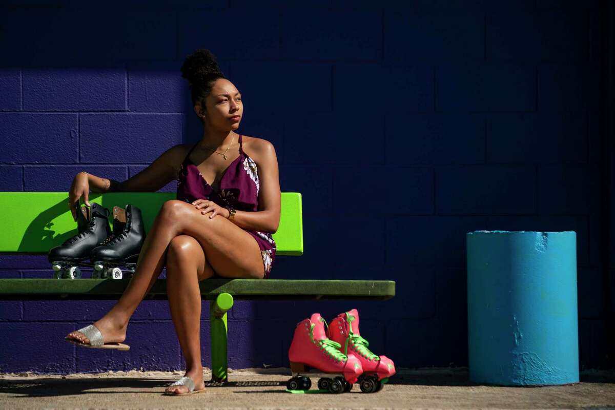 Asa Garcia sits outside Funcity Sk8 in Webster in February. Asa often brought her brother, Fred Harris, here on date nights so the two could skate. It was the last thing the siblings did together before his death in October 2021.