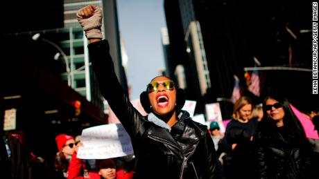 A woman shouts as she attends the Womens March on New York City in 2018.